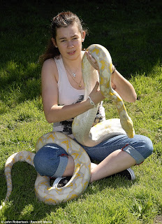 Girl shares home with 17ft-long albino python say's she's family 2