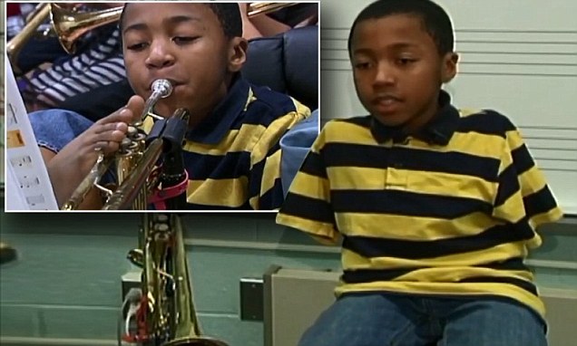 10 year old boy born without any arms masters how to play the trumpet with his TOES 1