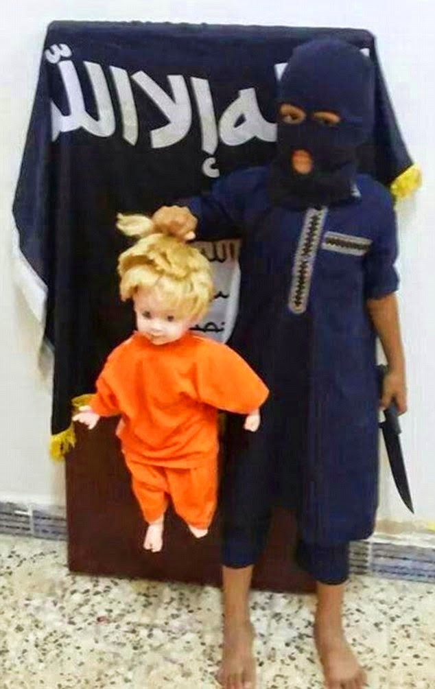Child Jihadist Re-enacts Beheading Of American Journalist James Foley By Executing A Doll 7