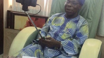 PHOTO: Former President Olusegun Obasanjo Using A Selfie Stick 25