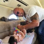 The Rock Pictured Changing His Daughter's diaper on a private jet [PHOTO] 17