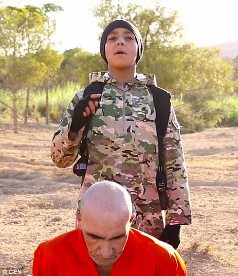 British child appear in new video shooting a prisoner in the head in Syria 5