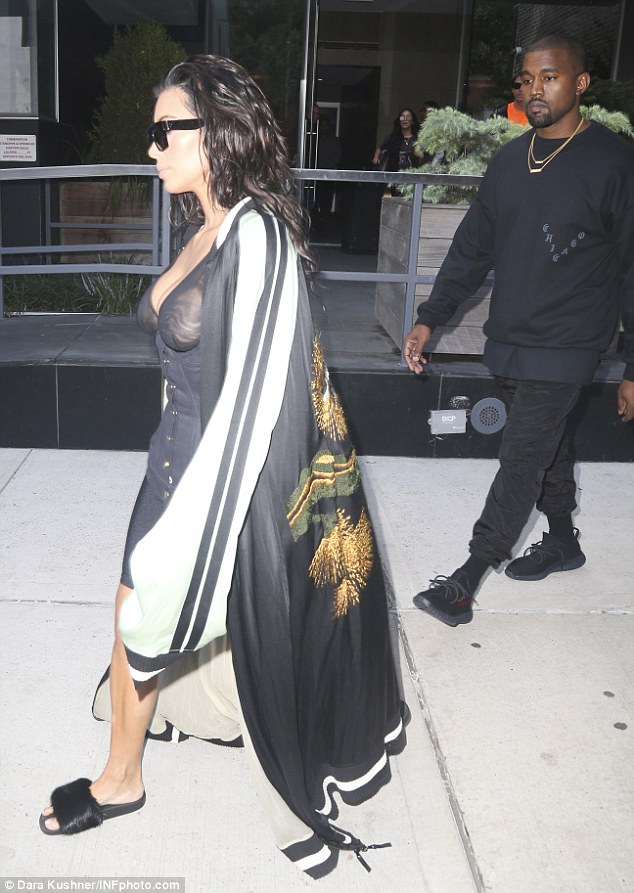 Kim Kardashian shows her nipples in a sheer bustier as she wears bizarre outfit 4