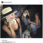 Khloe Kardashian exhales smoke while posing with wads of dollar bills in provocative snap 16
