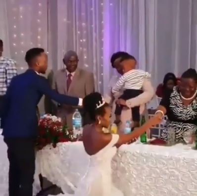 Outrage As Bride Walks On Her Kneels At Wedding Reception To Greet Her Guests [Video] 1