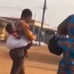 Val's Day Special: Man Carries Baby On His Back As He Strolls To Work With His Wife 9
