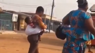 Val's Day Special: Man Carries Baby On His Back As He Strolls To Work With His Wife 8